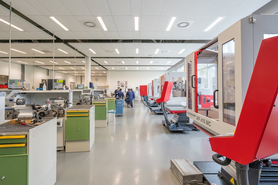 Spacious workshop with state-of-the-art machinery, highlighting industry and technology.